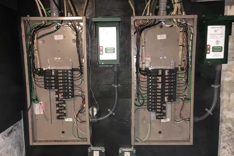 Electrician installing whole house surge protection in Manchester, NH